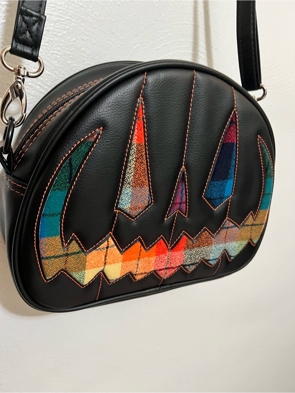 Love, Pain and Stitches Black Pumpkin Face Plaid Crossbody Bag